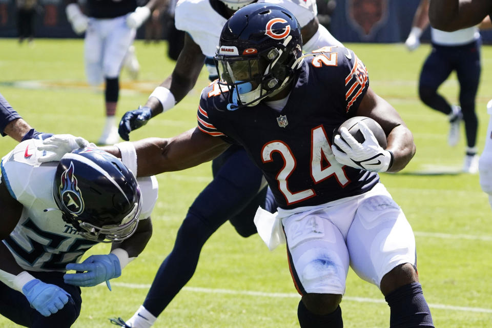 Aug 12, 2023; Chicago, Illinois, USA; Chicago Bears running back Khalil Herbert (24) catches a pass and runs for a touchdown against Tennessee Titans cornerback Chris Jackson (35) during the first quarter at Soldier Field. Mandatory Credit: David Banks-USA TODAY Sports ORG XMIT: IMAGN-710965 ORIG FILE ID: 20230812_szo_bb6_0013 .JPG