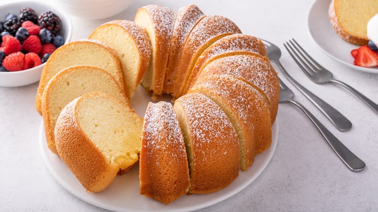 Sour cream pound cake on plate with powdered sugar