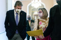 FILE - Sen. Joe Manchin, D-W.Va., left, walks with Sen. Kyrsten Sinema, D-Ariz., with Sen. Patty Murray, D-Wash., behind them at center, after attending a Democratic policy luncheon, on Nov. 16, 2021, on Capitol Hill in Washington. While Manchin and Sinema’s opposition to changing Senate rules stalled the party's signature voting legislation this month, they have been reliable votes on President Joe Biden's nominees to the courts. The two Democratic senators will be the center of attention as Biden moves forward with a pick to replace the retiring Justice Stephen Breyer. (AP Photo/Jacquelyn Martin, File)