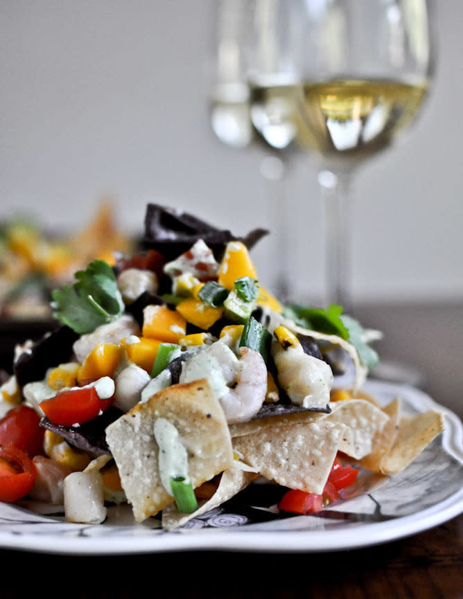 <strong>Get the <a href="http://www.howsweeteats.com/2012/07/summertime-seafood-nachos-with-grilled-corn-avocado-cream/">Summertime Seafood Nachos with Grilled Corn & Avocado Cream from How Sweet It Is</a></strong>