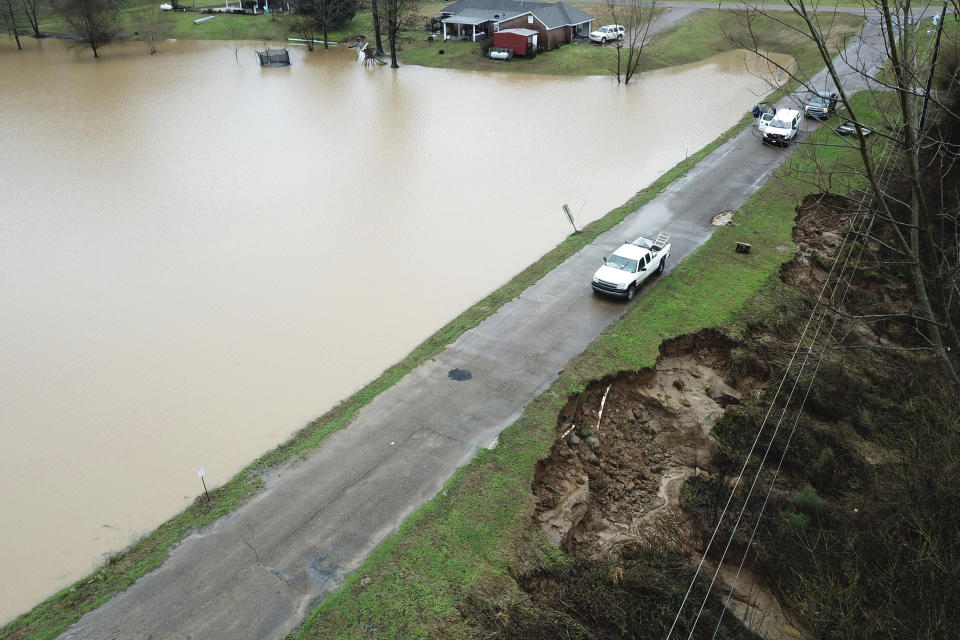 FILE - In this Feb. 11, 2020, file, aerial drone photo provided by the Mississippi Emergency Management Agency shows a potential dam/levee failure in the Springridge Place subdivision in Yazoo County, Miss. Heavy rains and recent flooding across the Southeastern U.S. have highlighted a potential public safety concern for some dams. An Associated Press review has identified hundreds of high hazard dams in the South that lack formal emergency action plans. (David Battaly/Mississippi Emergency Management Agency via AP, File)