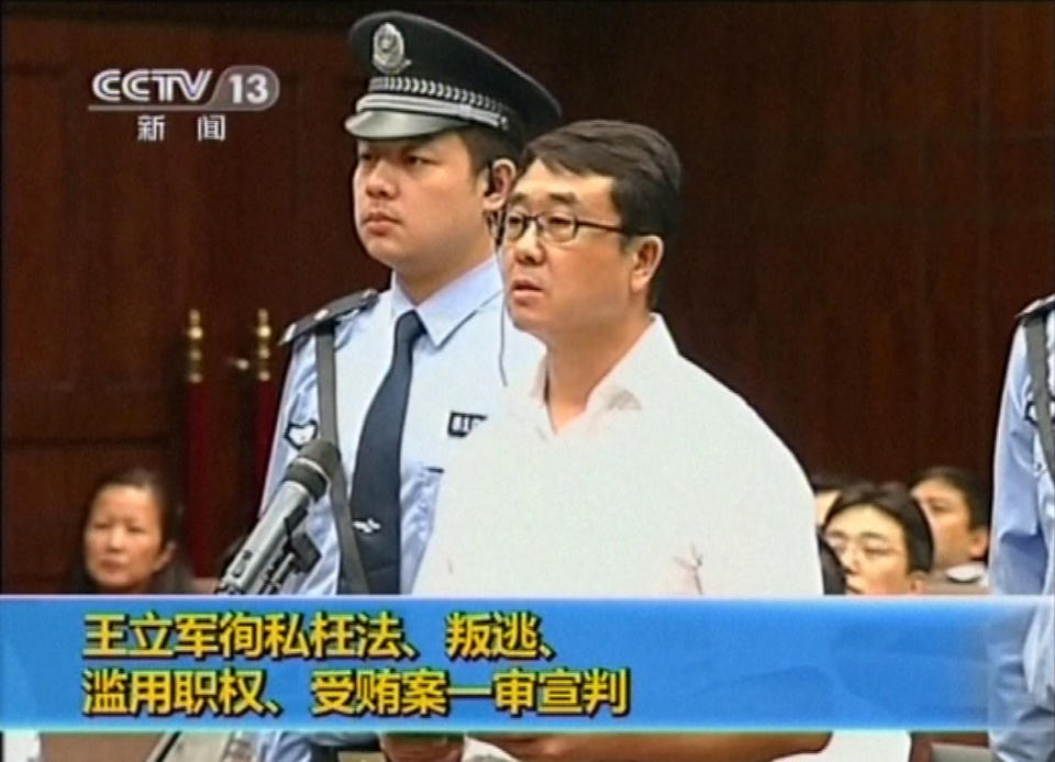 CORRECTS DATE - In this Sept. 18, 2012 video image taken from CCTV, Wang Lijun speaks during his trial at the Chengdu Intermediate People's Court in Chengdu, southwest China's Sichuan province,. Wang, the Chinese police chief whose thwarted defection exposed murder and infighting in high places was sentenced to 15 years in prison Monday, Sept. 24, 2012, setting the stage for China's leadership to close out the divisive scandal and move ahead with a generational handover of power. (AP Photo/CCTV via AP video) CHINA OUT, TV OUT