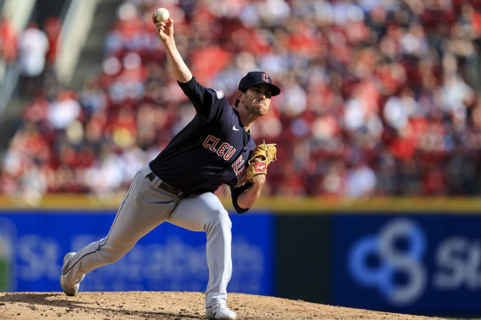 Cleveland Guardians' Shane Bieber throws during the fourth inning of the team's baseball game against the Cincinnati Reds in Cincinnati, Tuesday, April 12, 2022. (AP Photo/Aaron Doster)