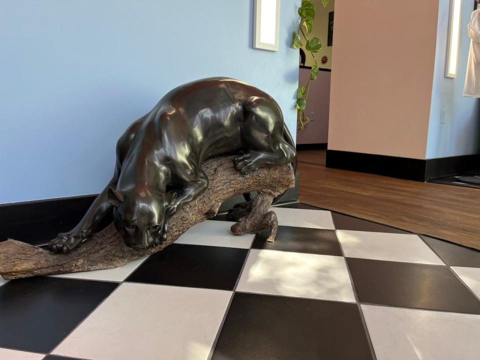 Using resources such as Facebook Marketplace and estate sales, they acquired some unique pieces, like a giant panther statue.
