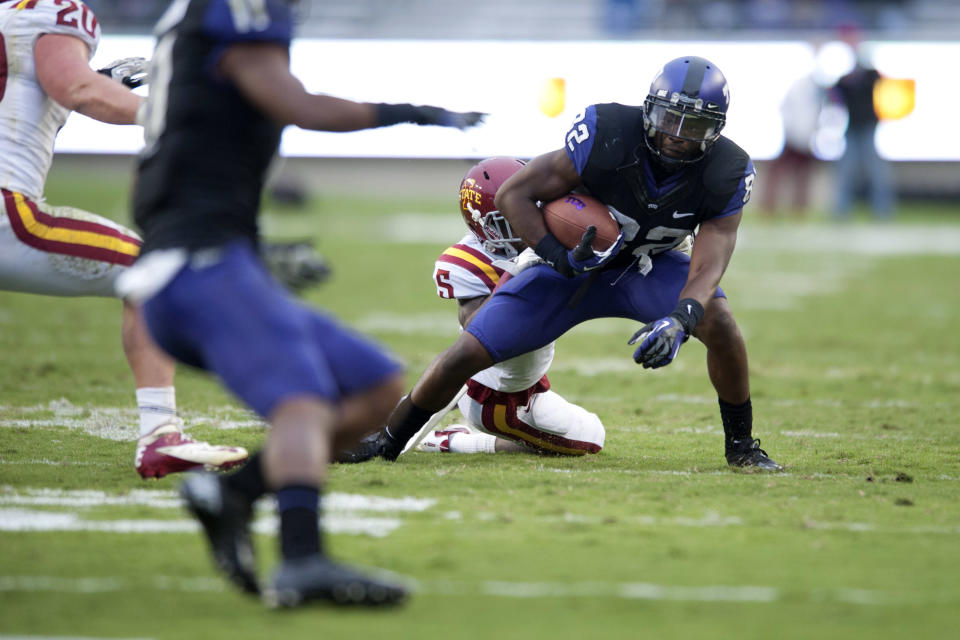 Josh Boyce #82 of the TCU Horned Frogs tries to break a tackle during the Big 12 Conference game against the Iowa State Cyclones on October 6, 2012 at Amon G. Carter Stadium in Fort Worth, Texas. (Photo by Cooper Neill/Getty Images)