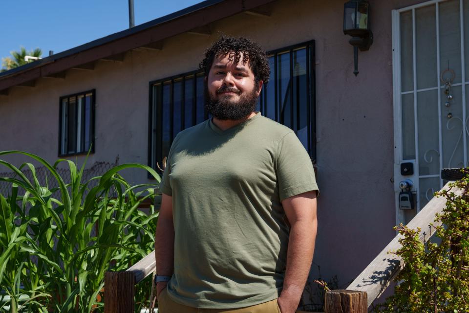 Hernan Villegas poses for a portrait outside Trans Queer Pueblo on June 25, 2023, in Phoenix.