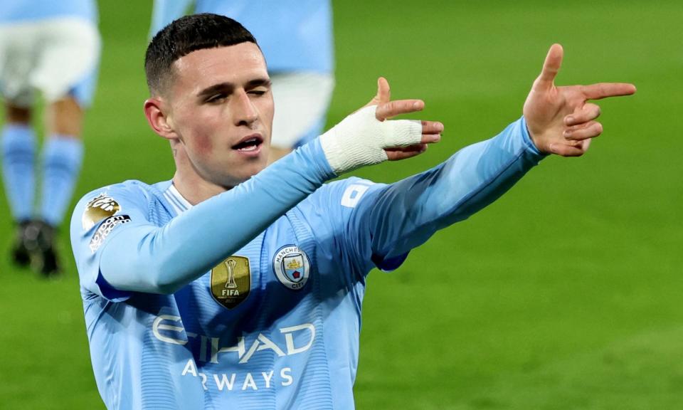 <span>Phil Foden celebrates the second goal of a clinical hat-trick to earn Manchester City victory at Brentford.</span><span>Photograph: David Klein/Reuters</span>