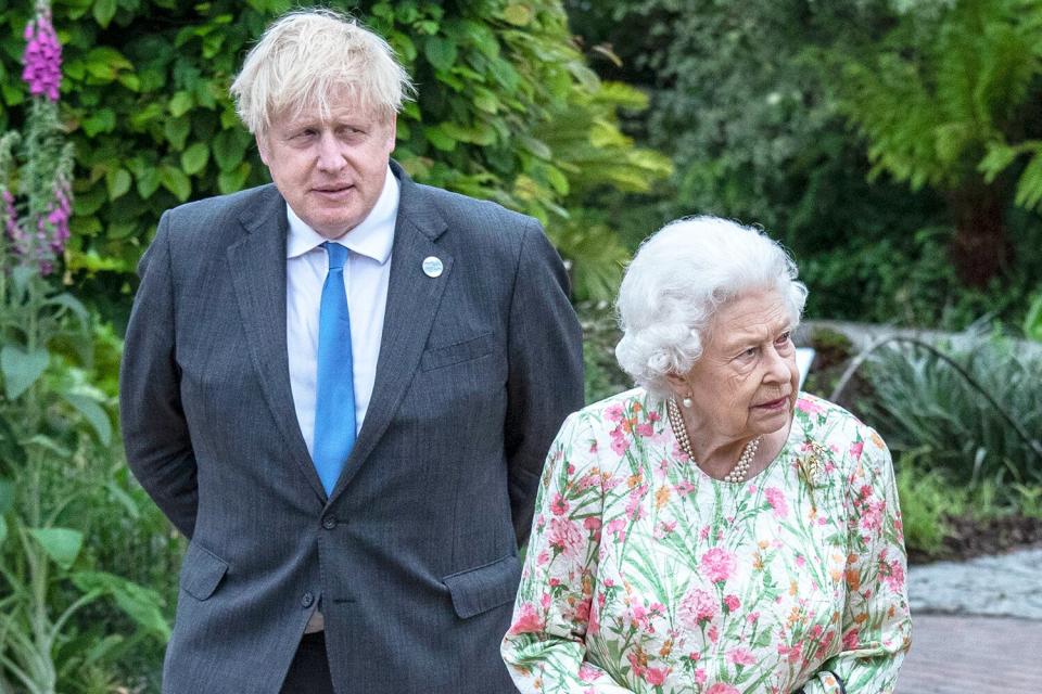 British Prime Minister Boris Johnson and Queen Elizabeth II arrive at a drinks reception for Queen Elizabeth II and G7 leaders at The Eden Project during the G7 Summit on June 11, 2021 in St Austell, Cornwall, England.