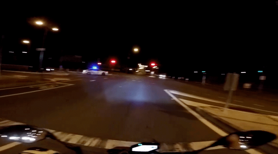 A police car can be seen switching on its sirens to follow the driver. Photo: Dashcam Owners Australia