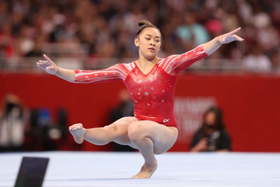 Suni Lee competes in the floor exercise during the U.S. Gymnastics Olympic Trials at America’s Center in St Louis.