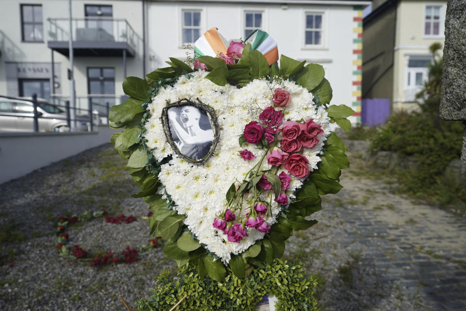 Floral tributes left outside the former home of Sinead O'Connor ahead of the late singer's funeral, in Bray, Co Wicklow, Ireland, Tuesday, Aug. 8, 2023. O’Connor was found unresponsive in a home in southeast London on July 26, 2023. (Niall Carson/PA via AP)
