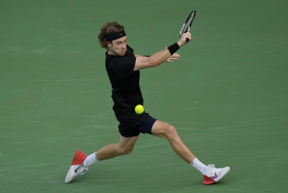 Andrey Rublev returns the ball to Germany's Alexander Zverev during their semi final match of the Dubai Duty Free Tennis Championships in Dubai, United Arab Emirates, Friday, March 3, 2023. (AP Photo/Kamran Jebreili)