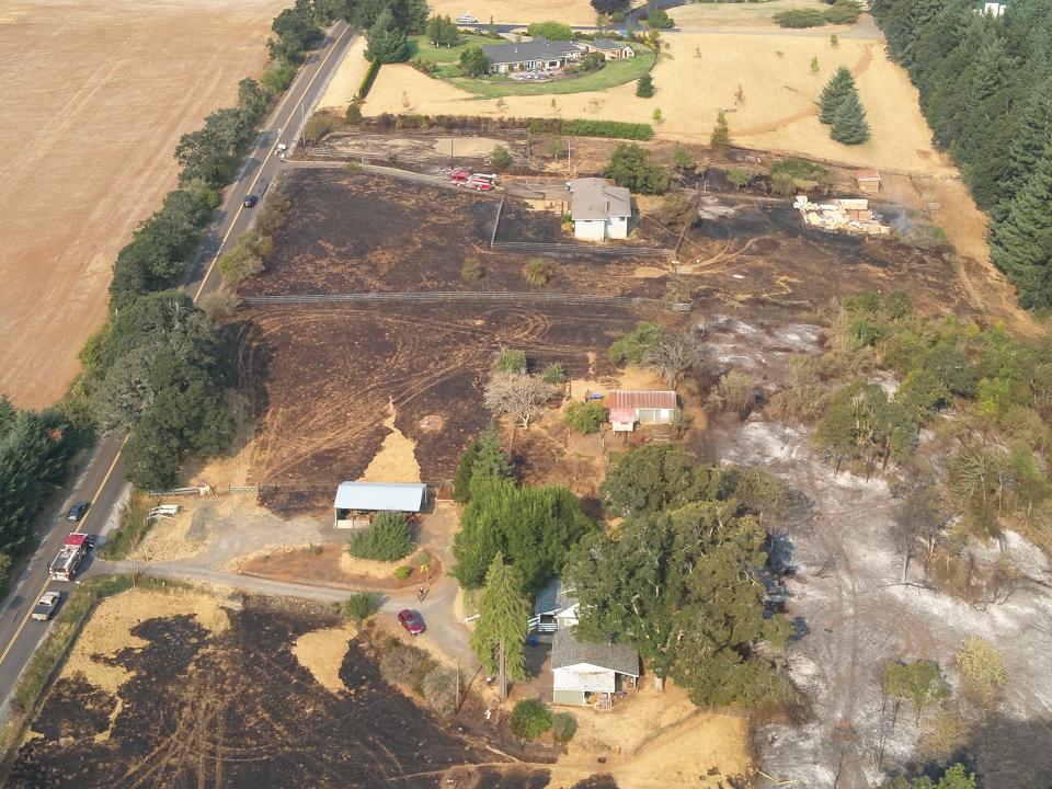 The homes of two properties on Jory Hill Road S were saved during the 50-acre Liberty Fire on Aug. 23 near Salem, as shown in aerial photos captured by a Salem Police Department drone pilot the morning after the fire.