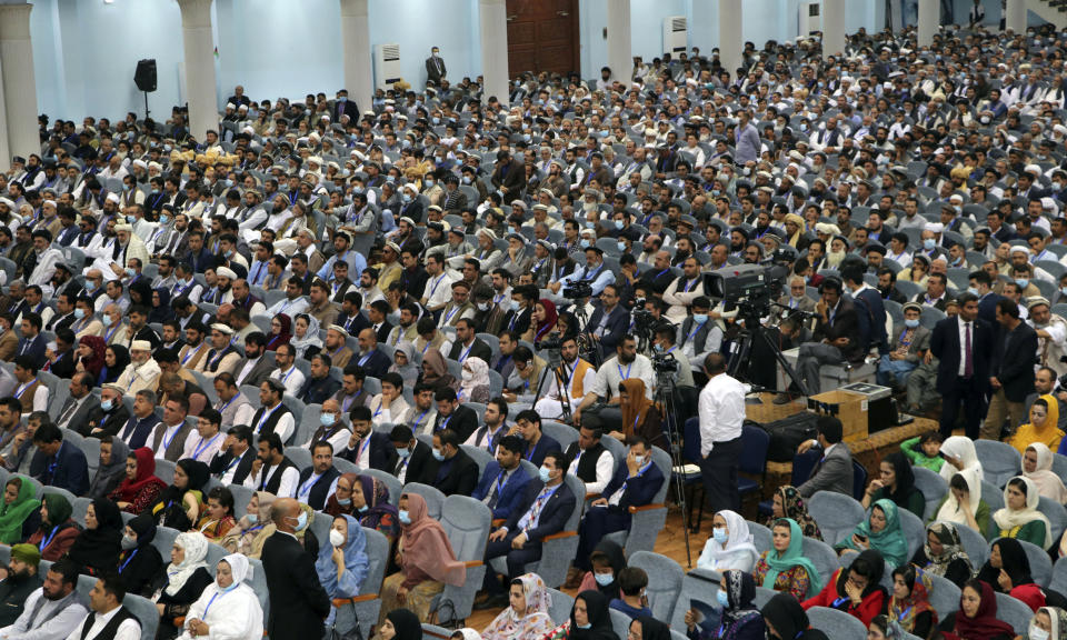 Delegates, attend the last day of an Afghan Loya Jirga or traditional council, in Kabul, Afghanistan, Sunday, Aug. 9, 2020. The council concluded Sunday with hundreds of delegates agreeing to free 400 Taliban members, paving the way for an early start to negotiations between Afghanistan's warring sides. (AP Photo)