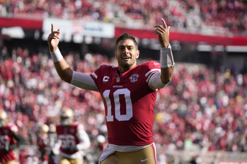 San Francisco 49ers quarterback Jimmy Garoppolo lifts his arms as he reacts toward