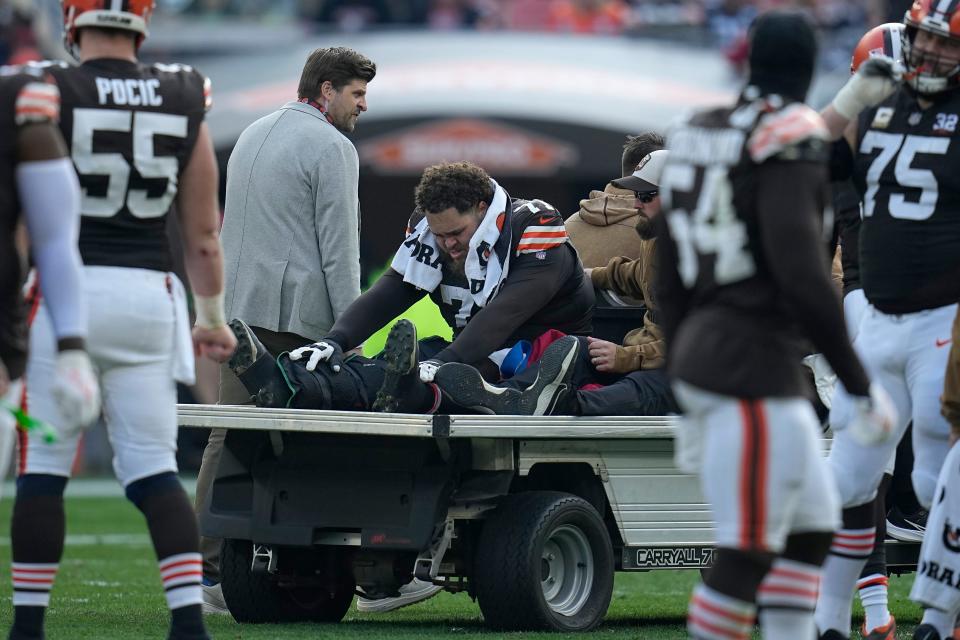 Cleveland Browns offensive tackle Jedrick Wills Jr. is carted off the field during a game against the Arizona Cardinals on Nov. 5 in Cleveland.