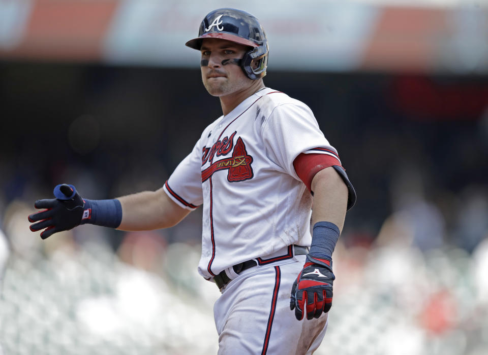 Atlanta Braves' Austin Riley celebrates after making the game winning hit off Washington Nationals' Jordan Weems in the twelfth inning of a baseball game, Sunday, July 10, 2022, in Atlanta. (AP Photo/Ben Margot)