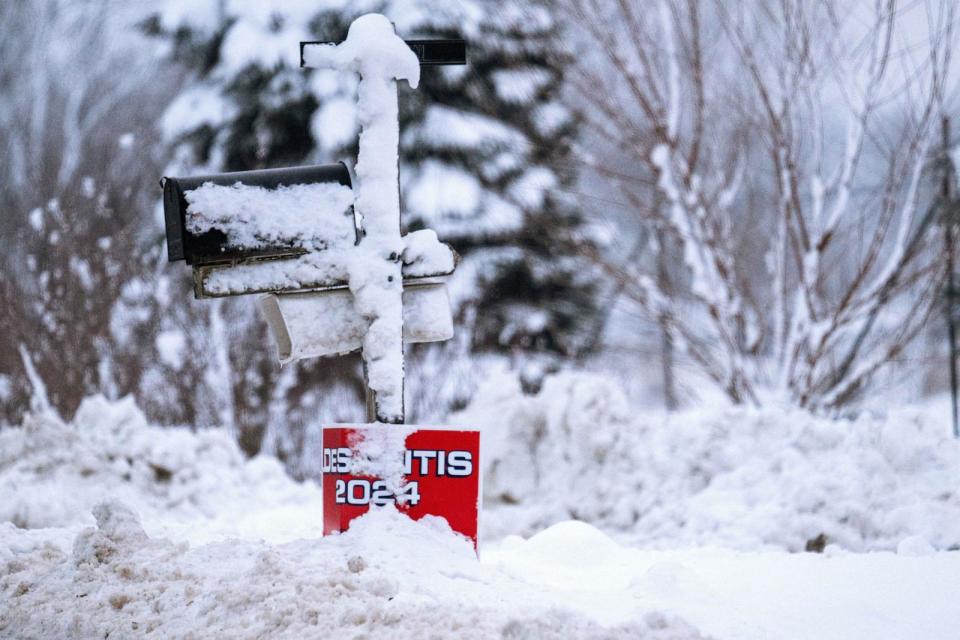 PHOTO: Snow covers a placard for Republican presidential candidate Florida Governor Ron DeSantis in Davenport, Iowa, on Jan. 11, 2024, (Jim Watson/AFP via Getty Images)