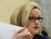 Senator Claire McCaskill (D-MO) reads a General Motors internal document at the Senate Commerce and Transportation Consumer Protection, Product Safety and Insurance subcommittee, which she chairs, in Washington April 2, 2014. REUTERS/Gary Cameron