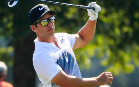 Paul Casey of England hits balls on the driving range during practice for the Tour Championship - Credit: EPA