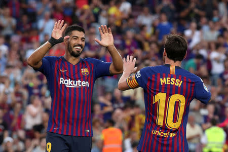 Soccer Football - La Liga Santander - FC Barcelona v SD Huesca - Camp Nou, Barcelona, Spain - September 2, 2018 Barcelona's Lionel Messi celebrates scoring their sixth goal with Luis Suarez REUTERS/Albert Gea