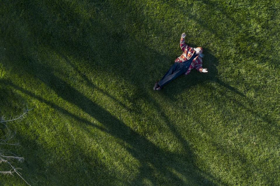 David Crosby at home in San Ynez laying on the grass