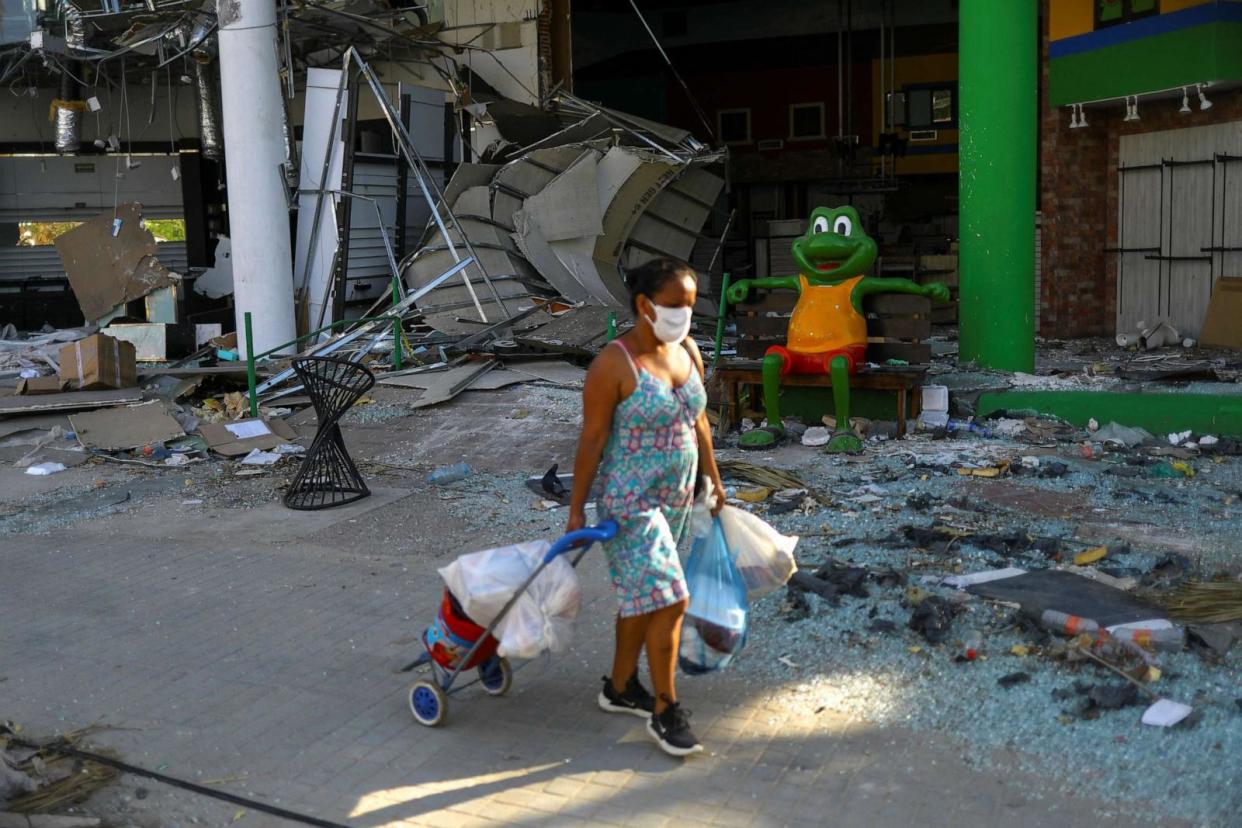PHOTO: A woman walks on a debris-strewn street in a tourist area, in the aftermath of Hurricane Otis, in Acapulco, Mexico, Nov. 1, 2023. (Jose Luis Gonzalez/Reuters)