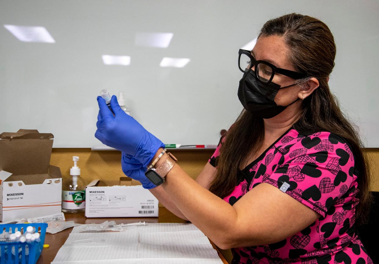 Licensed vocational nurse Susie Garcia prepares doses of the monkeypox vaccine for patients at DAP Health in Palm Springs, Calif., Saturday, Sept. 10, 2022. 