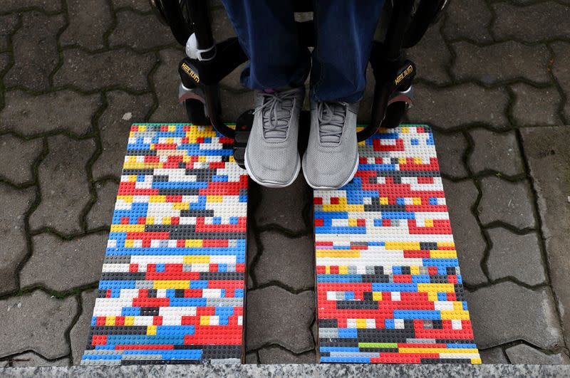 Rita Ebel, nicknamed "Lego grandma" tests one of her wheelchair ramps built from donated Lego bricks in Hanau