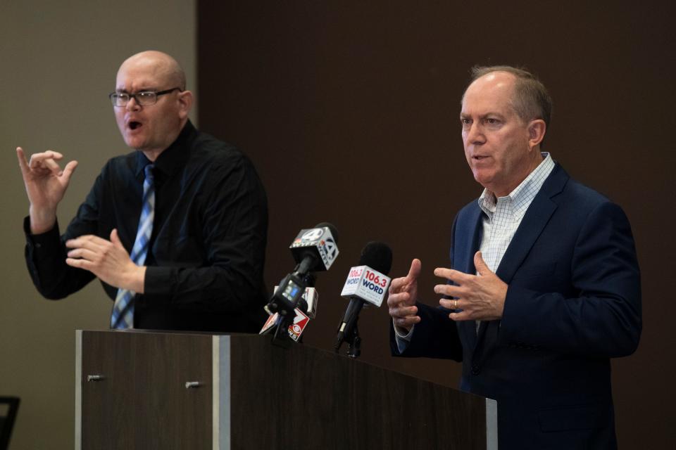 Jason Hurdich signs while Greenville Mayor Knox White speaks at a press conference about COVID-19 held at the Greenville Convention Center Friday, Mar. 27, 2020. 