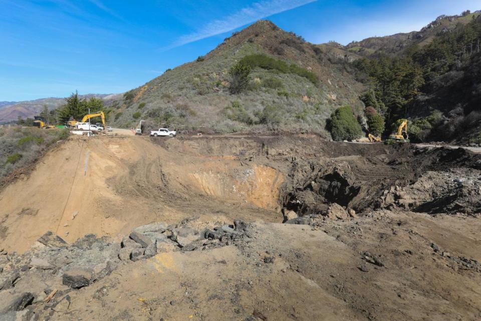 Highway 1 washed out at Rat Creek about 30 miles north of the Monterey, San Luis Obispo county line. Up the canyon scars from the Dolan fire can still be seen. Heavy atmospheric river event carried mud, trees and boulders plugging the culverts and washing away the road. Workers are about 2/3 through with removal, the next step will be designing the replacement. Trucks haul away debris Thursday Feb. 19, 2021.