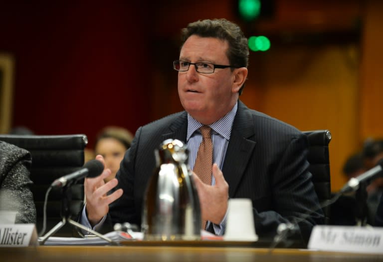 Laurence McAllister, managing director of French drugmaker Sanofi, speaks at an Australian parliamentary hearing in Sydney on July 1, 2015