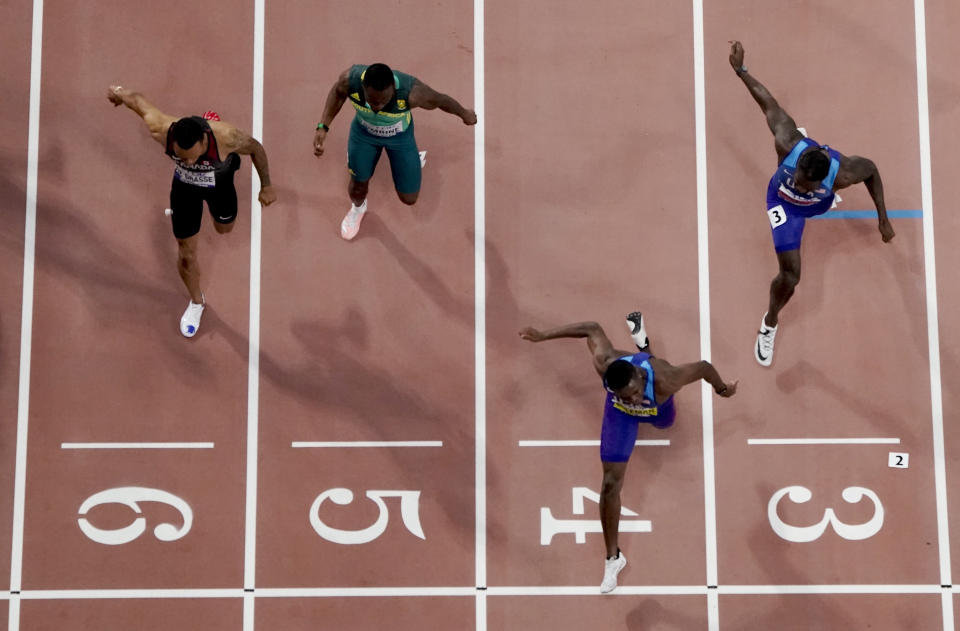 Christian Coleman, of the United States, crosses the finish line to win the men's 100 meter final ahead of silver medalist Justin Gatlin, also of the United States, during the World Athletics Championships in Doha, Qatar, Saturday, Sept. 28, 2019. (AP Photo/Morry Gash)