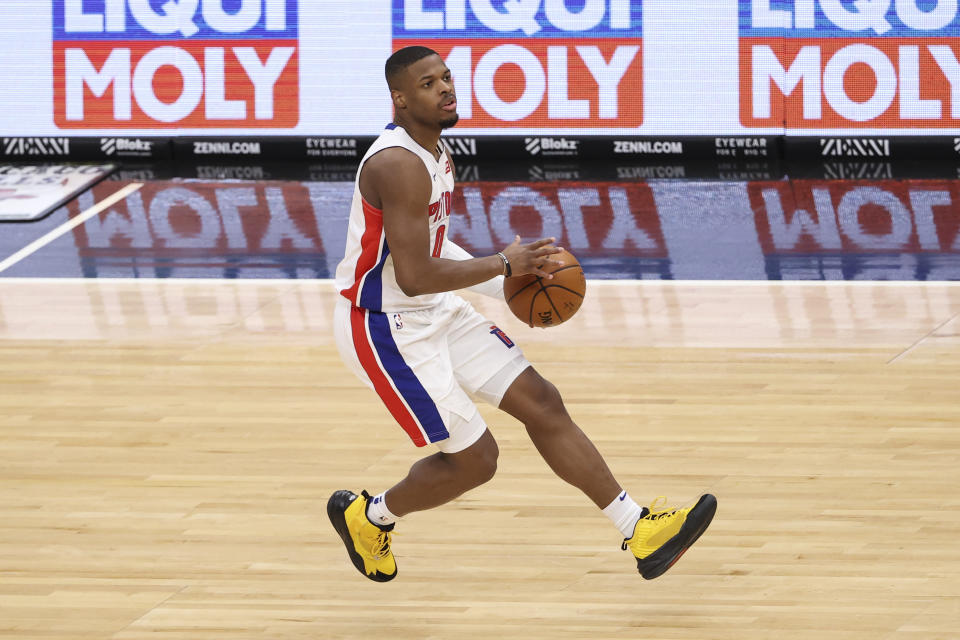 Feb 17, 2021; Chicago, Illinois, USA; Detroit Pistons guard Dennis Smith Jr. (0) brings the ball up court against the Chicago Bulls during the second half of an NBA game at United Center. 