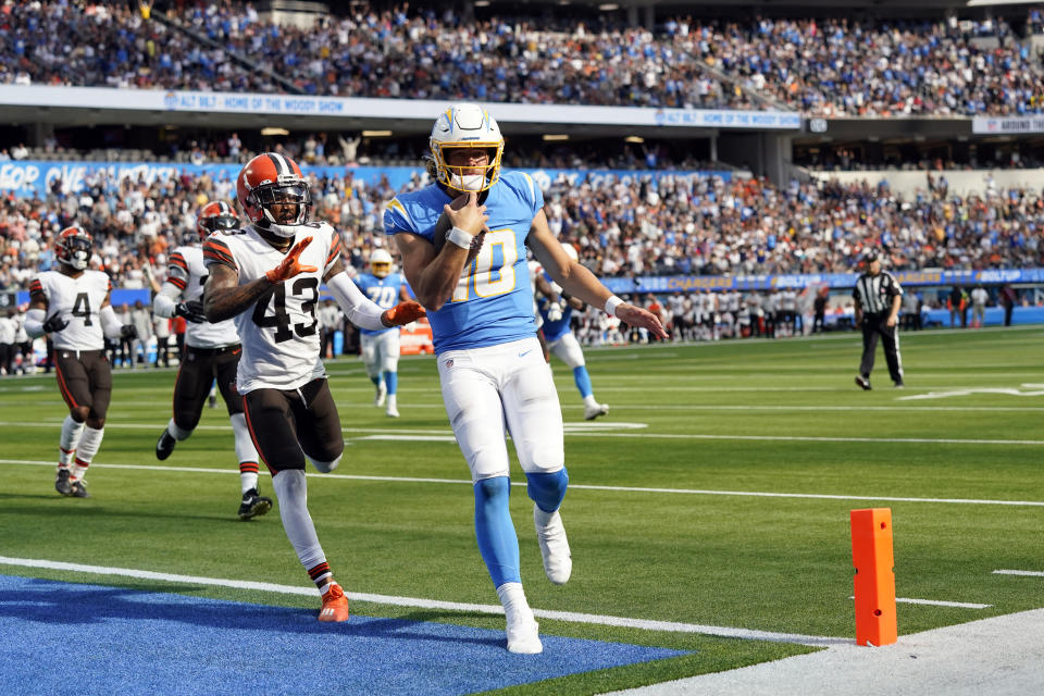 Los Angeles Chargers quarterback Justin Herbert (10) scores a touchdown during the second half of an NFL football game against the Cleveland Browns Sunday, Oct. 10, 2021, in Inglewood, Calif. (AP Photo/Gregory Bull)