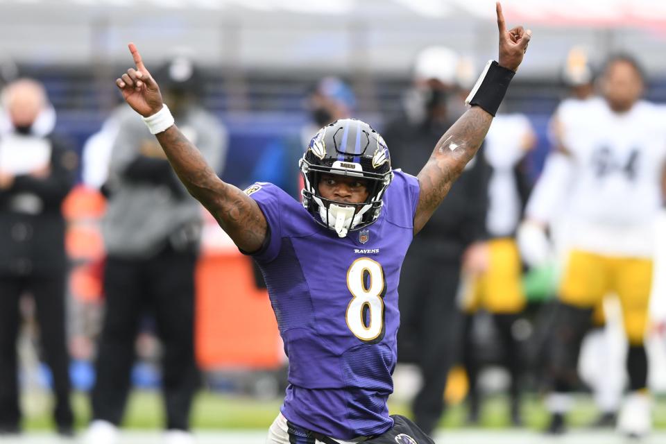 Baltimore Ravens quarterback Lamar Jackson (8) celebrates after a touchdown against the Pittsburgh Steelers in the second quarter at M&T Bank Stadium.