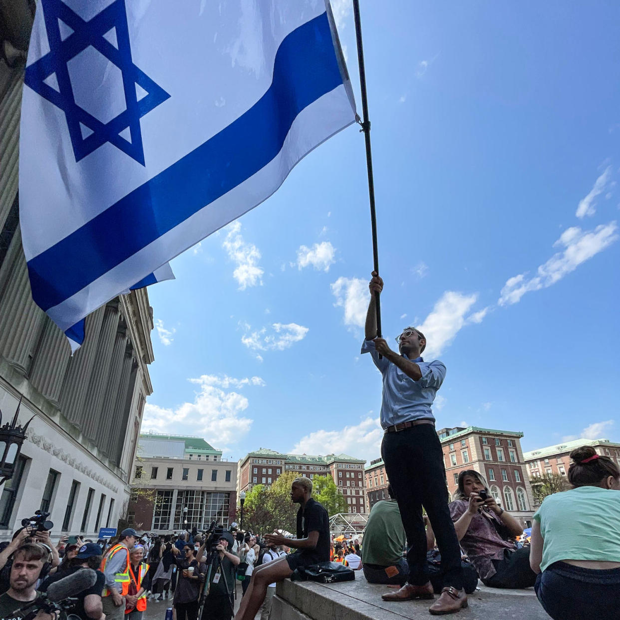 David Lederer waves an Israeli flag on campus (Doha Madani / NBC News)