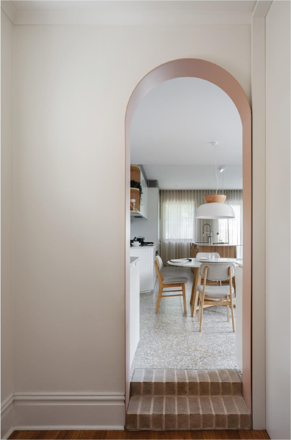 Painted archway leading to kitchen