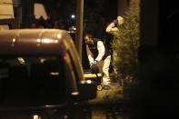 Turkish police officers gather as they prepare to enter the Saudi Arabia's Consulate in Istanbul, Monday, Oct. 15, 2018. Turkish crime scene investigators dressed in coveralls and gloves entered the consulate Monday, nearly two weeks after the disappearance and alleged slaying of Saudi writer Jamal Khashoggi there. (AP Photo/Petros Giannakouris)