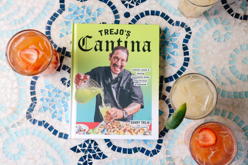 Los Angeles, CA - November 27: A "Red Alert" and "Coconut-Pina-Guava Fresca" non-alcoholic cocktails are seen around his cookbook at Trejo's Hollywood Cantina on Monday, Nov. 27, 2023 in Los Angeles, CA. (Dania Maxwell / Los Angeles Times)