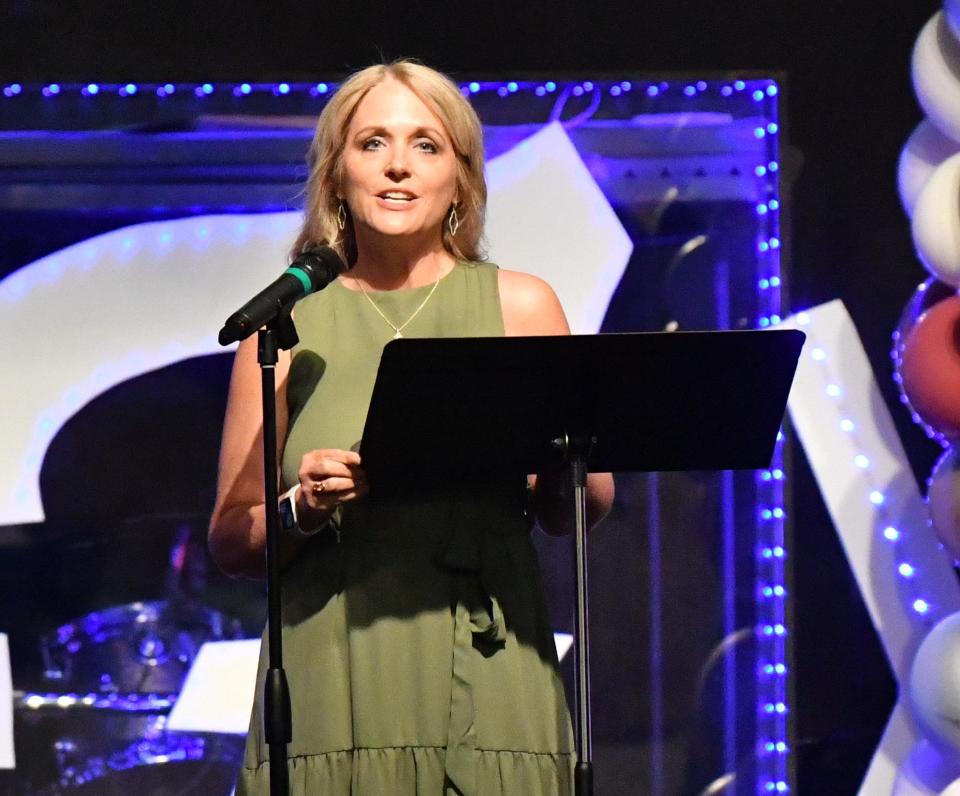 Wichita Falls ISD Community Partnerships Coordinator January Cadotte reads off the winners during the PIE Appreciation dinner at Faith Baptist Church.