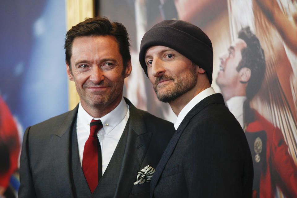 Hugh Jackman, left, and Michael Gracey, attend the world premiere of “The Greatest Showman” aboard the RMS Queen Mary 2 on Friday, Dec. 8, 2017, in New York. (Photo by Andy Kropa/Invision/AP)