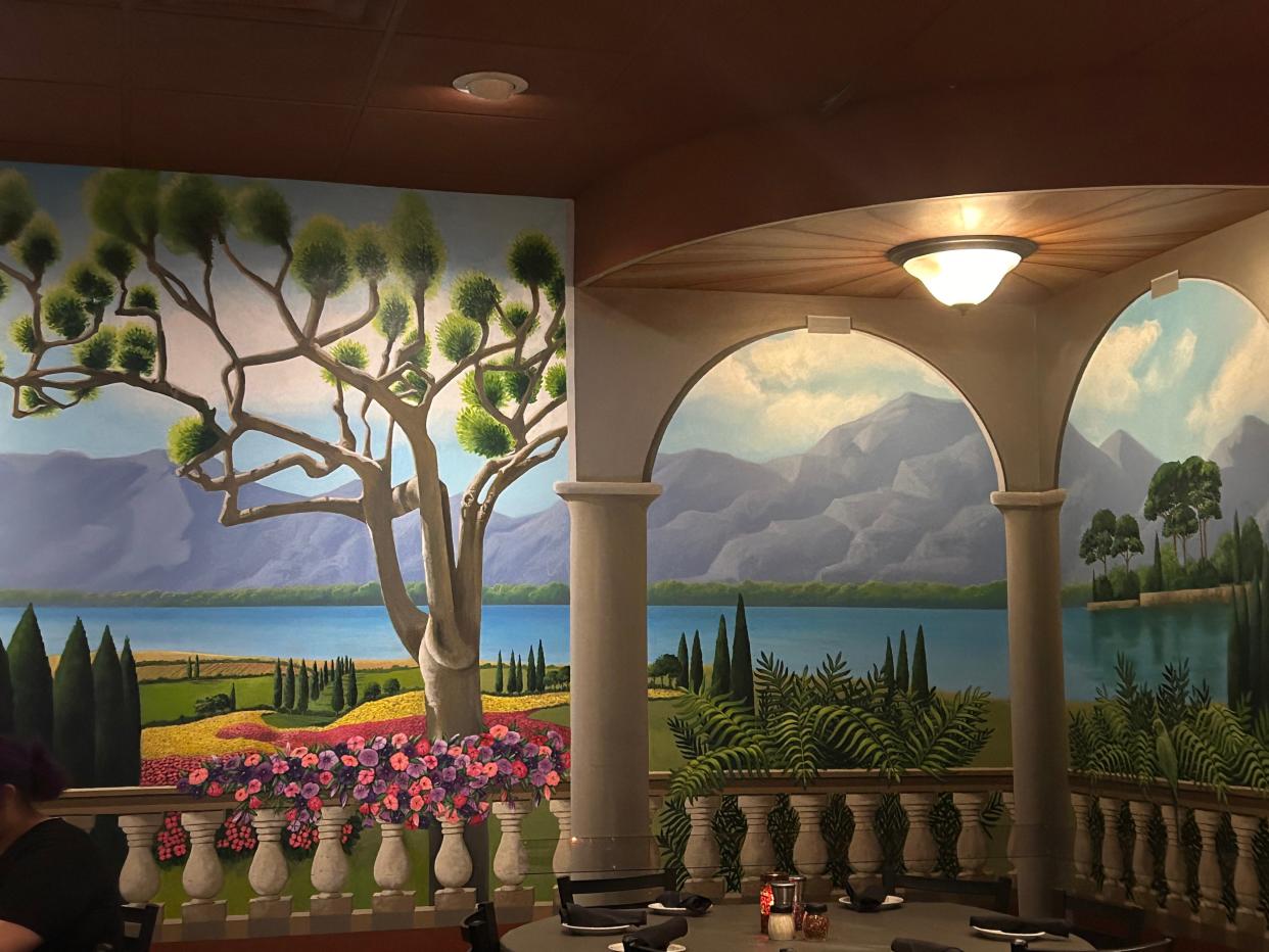 Patricia Harding created the large murals throughout Santosuosso's restaurant in Medina Township.