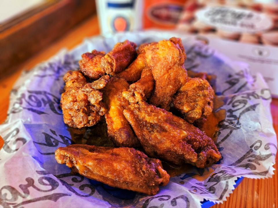 An order of "Ferg's Famous Wings" tossed in medium sauce at Ferg's Sports Bar & Grill in St. Petersburg.