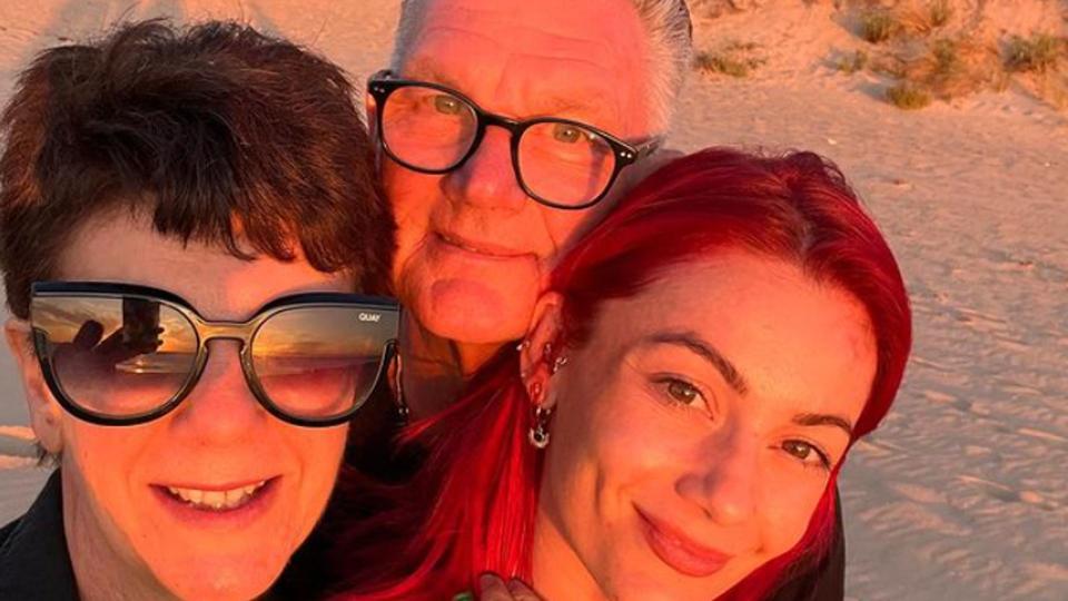 Dianne Buswell with an elderly couple on the beach