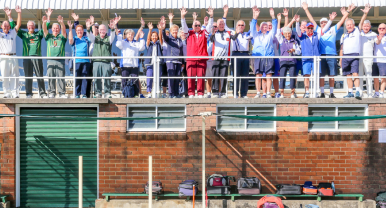 Members seen raising their hands in joy at the Bowling & Community Club, as it faces closure. 