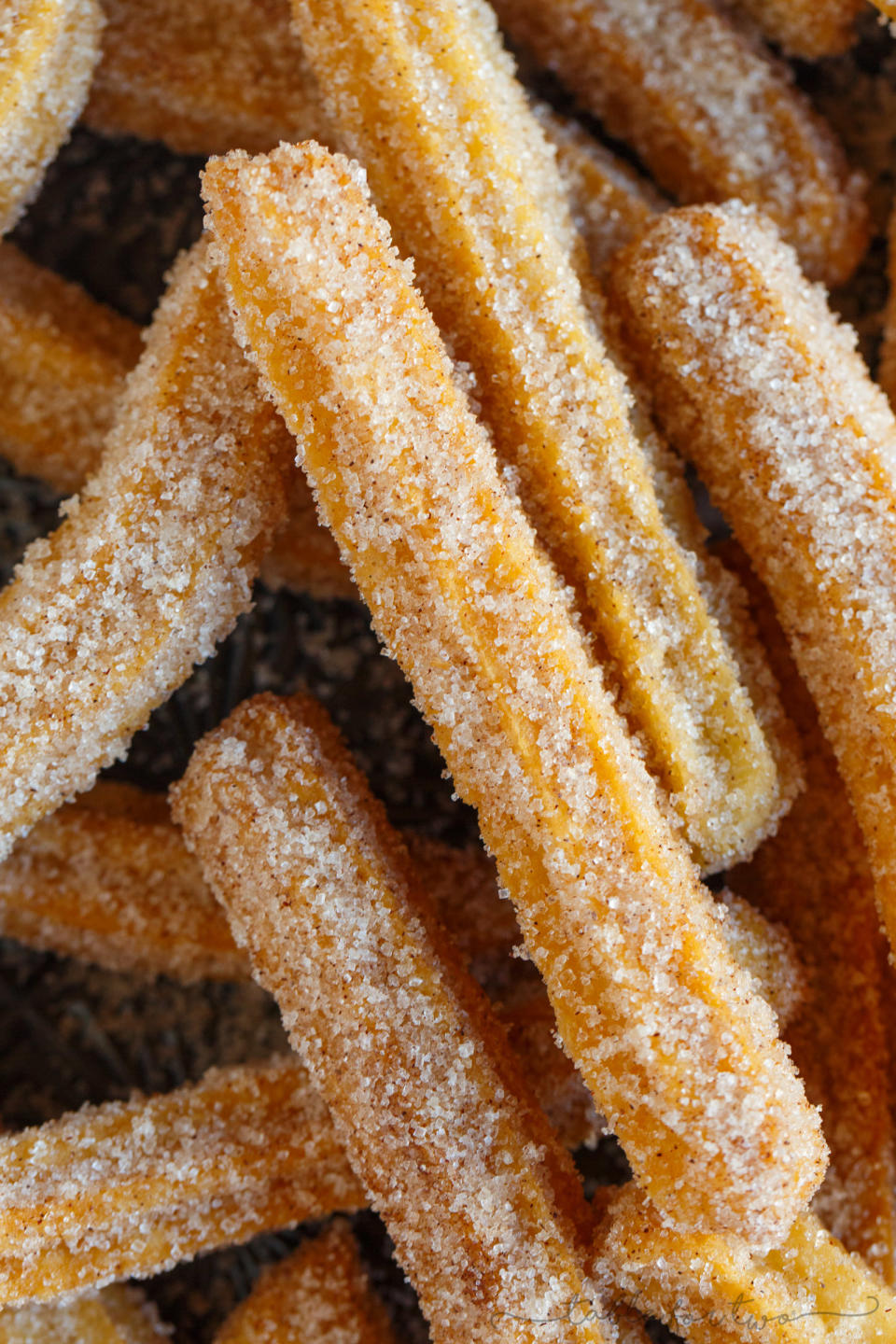 Homemade churros with sugar.