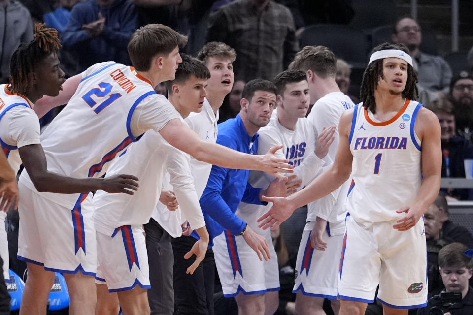 Florida guard Walter Clayton Jr. (1) celebrates after making a basket in the second half of a first-round college basketball game against Colorado in the NCAA Tournament, Friday, March 22, 2024, in Indianapolis. (AP Photo/Michael Conroy)