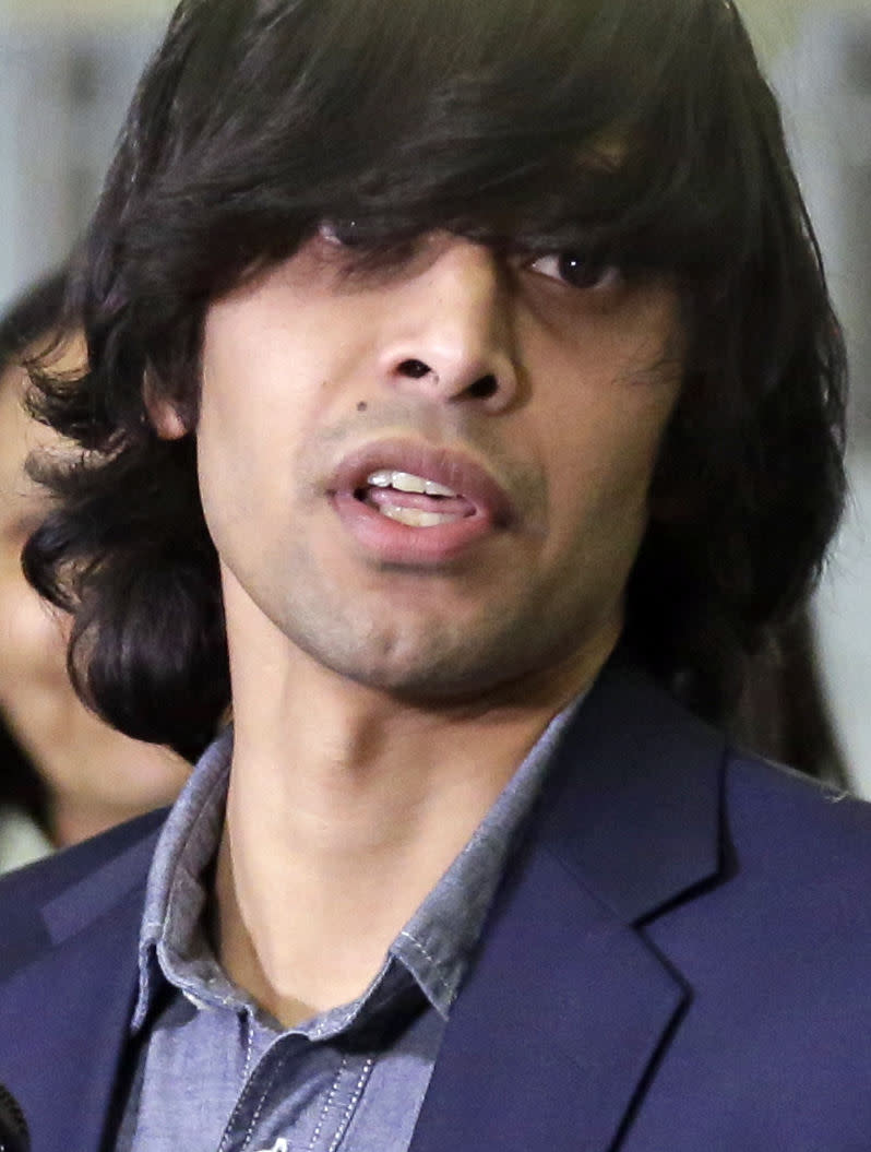 Shezanne Cassim speaks during a news conference after he arrived at the Minneapolis-St. Paul International Airport in Minneapolis on Thursday, Jan. 9, 2014 after being held in a maximum security prison since June 2013 in the United Arab Emirates for a parody video that was posted online. (AP Photo/Jim Mone)