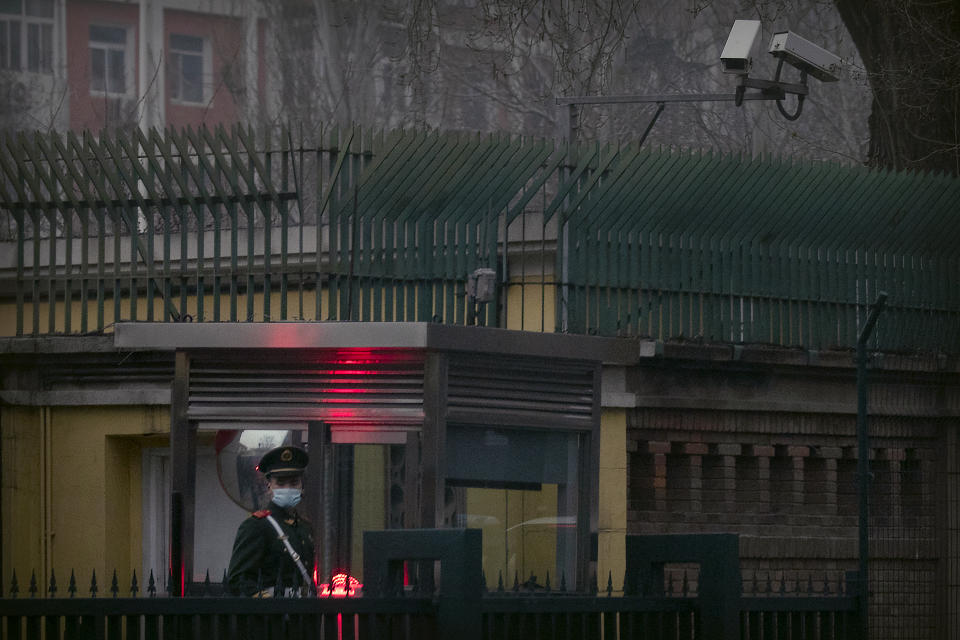 A Chinese paramilitary police officer stands guard outside the British Embassy in Beijing, Friday, March 26, 2021. China has announced sanctions on British individuals and entities following the U.K.'s joining the EU and others in sanctioning Chinese officials accused of human rights abuses in the Xinjiang region. (AP Photo/Mark Schiefelbein)